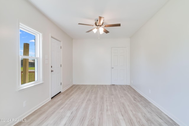 unfurnished room with ceiling fan and light hardwood / wood-style flooring