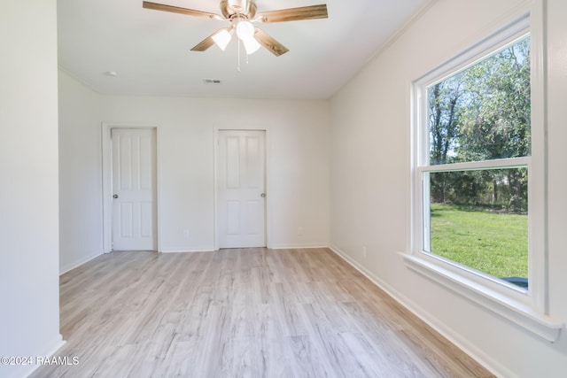 unfurnished bedroom featuring ceiling fan and light hardwood / wood-style flooring