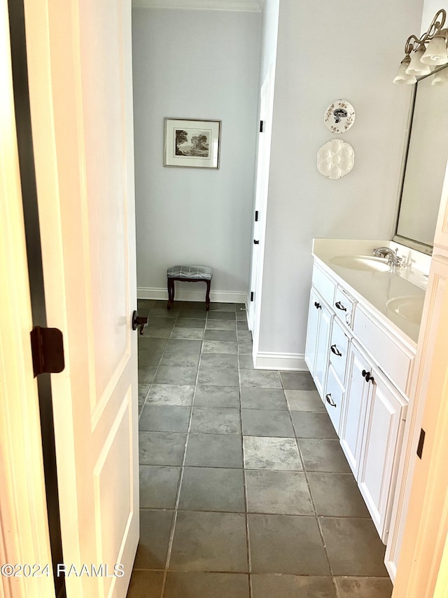 bathroom with tile patterned floors and vanity