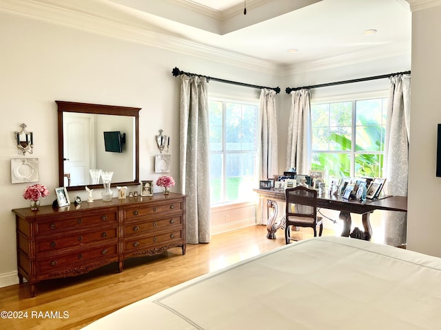 bedroom with wood-type flooring and ornamental molding