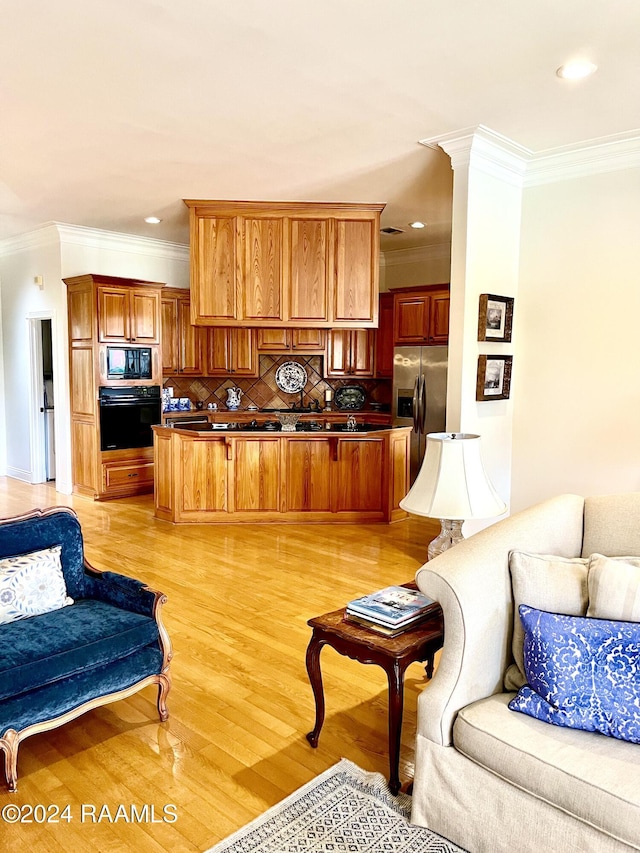 living room featuring light hardwood / wood-style flooring and crown molding