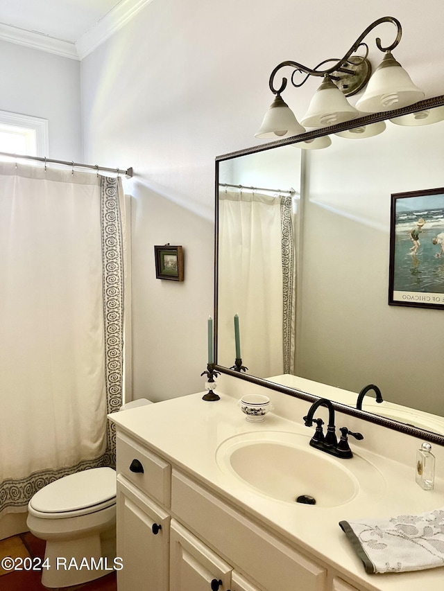 bathroom featuring vanity, toilet, curtained shower, and ornamental molding