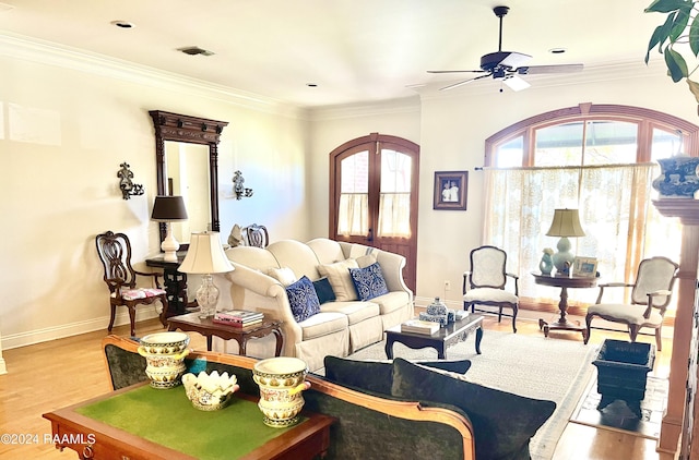 living room with ceiling fan, light hardwood / wood-style floors, and ornamental molding