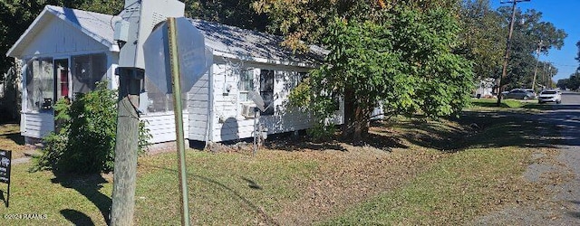 view of property exterior featuring a yard