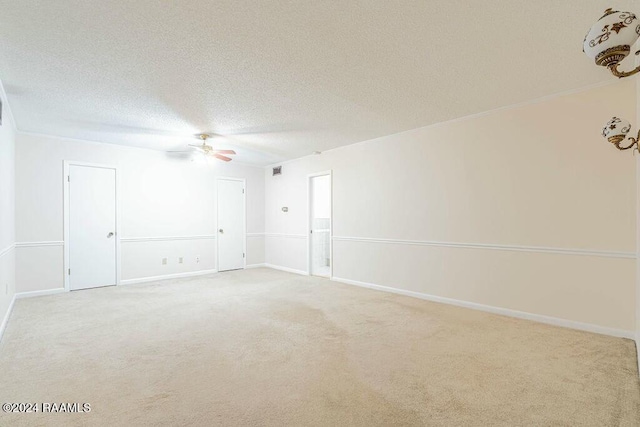 unfurnished room with ceiling fan, carpet, and a textured ceiling