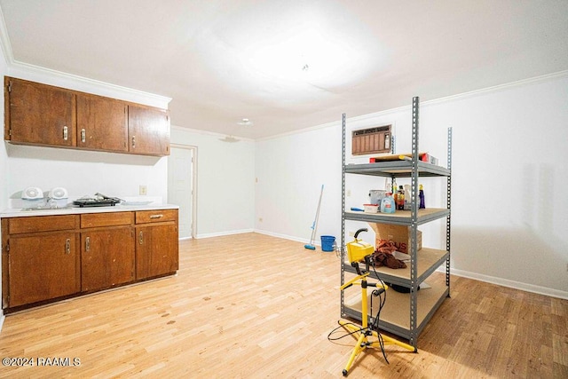 kitchen featuring light hardwood / wood-style floors and ornamental molding