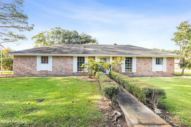 227 Meadow Ln, Lafayette, LA 70506 - ranch-style house with brick siding, a front lawn, and roof with shingles