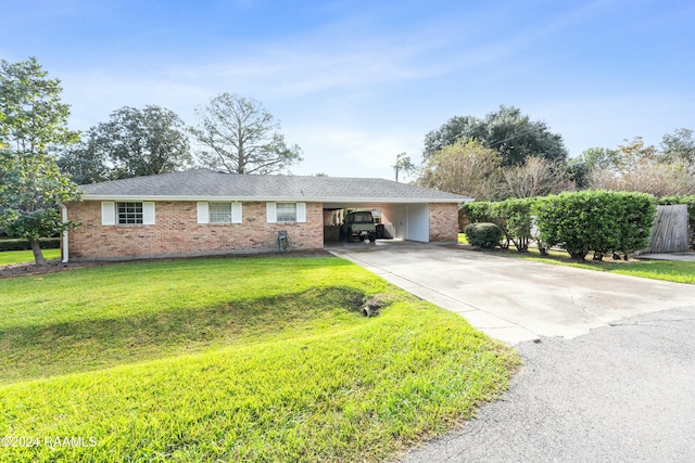 single story home with a front yard and a carport