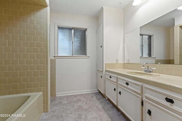 bathroom featuring backsplash, crown molding, and vanity