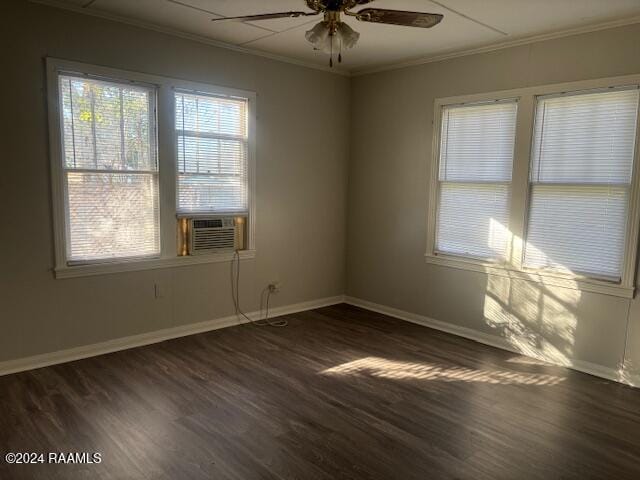 unfurnished room with cooling unit, dark hardwood / wood-style floors, ceiling fan, and ornamental molding