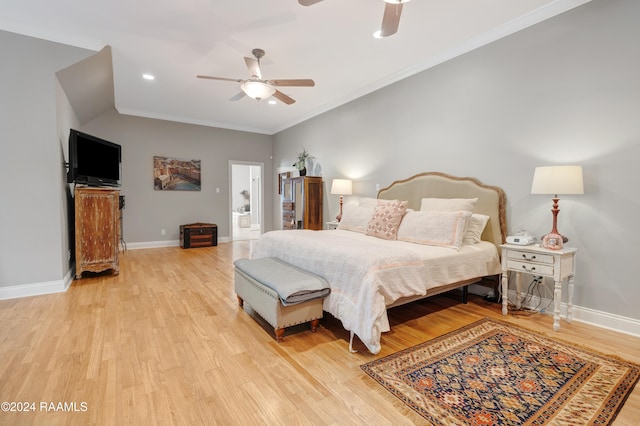 bedroom with ceiling fan, ornamental molding, and light wood-type flooring