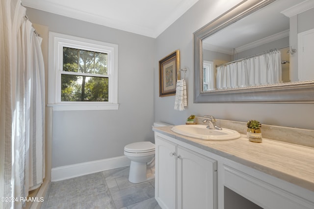 bathroom featuring tile patterned flooring, vanity, toilet, and crown molding