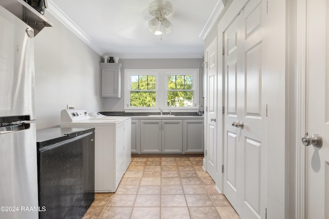 laundry area with cabinets, ornamental molding, sink, washer and dryer, and light tile patterned flooring