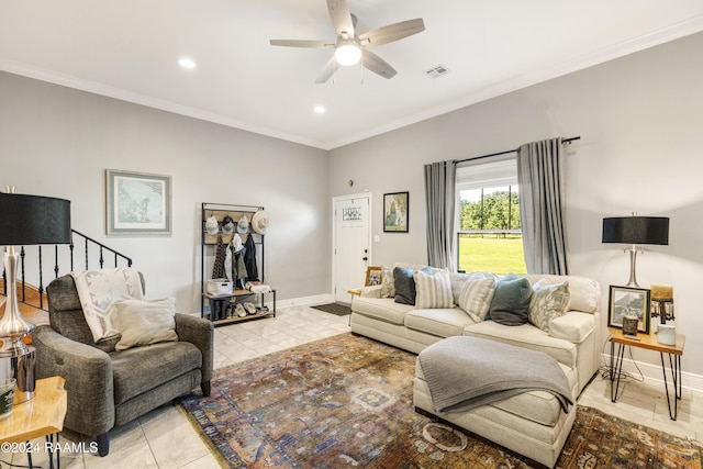 tiled living room featuring ceiling fan and ornamental molding