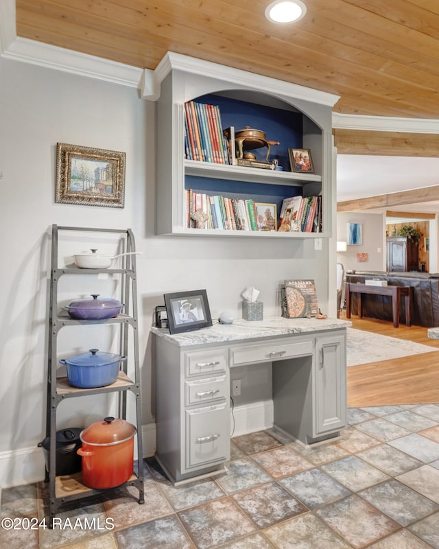 interior space featuring crown molding, wood ceiling, and vaulted ceiling