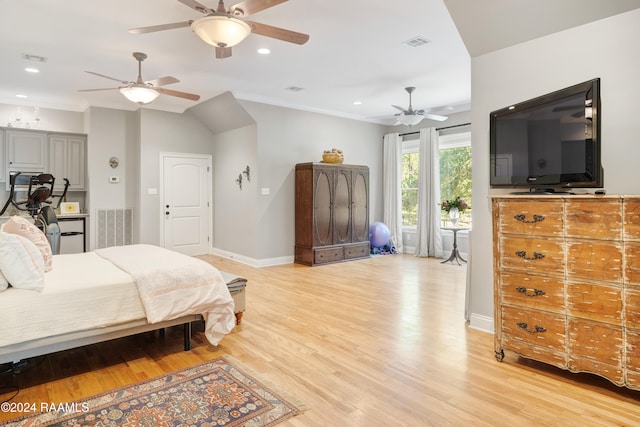 bedroom featuring ceiling fan, light hardwood / wood-style floors, and ornamental molding