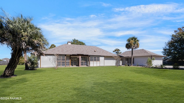 ranch-style home with a front yard