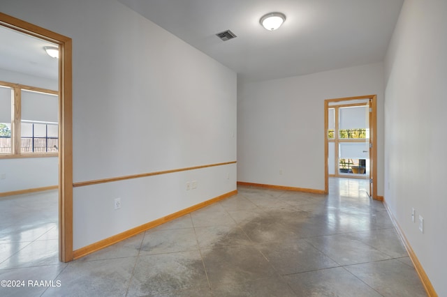 unfurnished room featuring a wealth of natural light