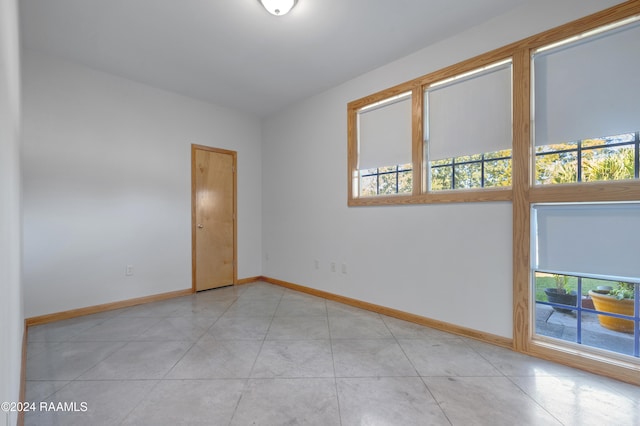 empty room with light tile patterned flooring