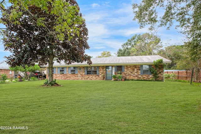 ranch-style home with a front yard