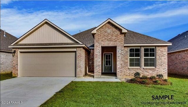 view of front of property featuring a front lawn and a garage