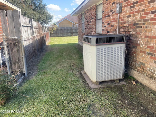 view of yard with central air condition unit