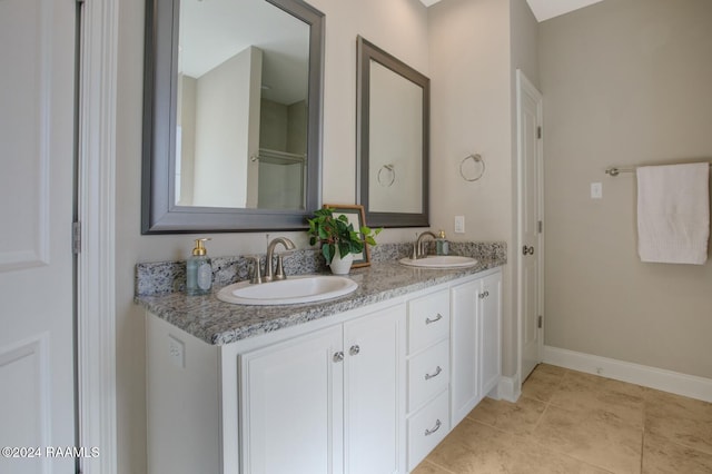 bathroom with tile patterned flooring and vanity