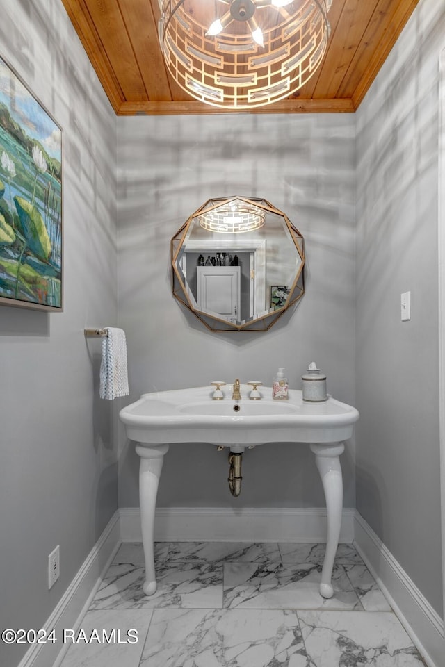 bathroom with ornamental molding and wooden ceiling