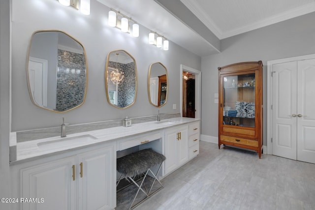 bathroom featuring vanity and crown molding