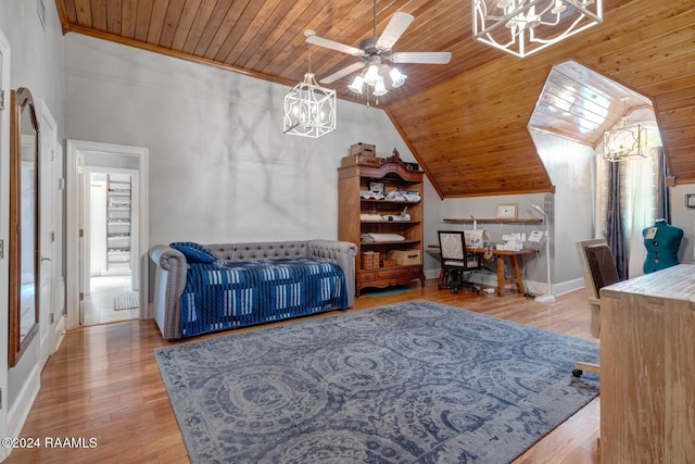 bedroom with lofted ceiling, crown molding, ceiling fan, light wood-type flooring, and wood ceiling