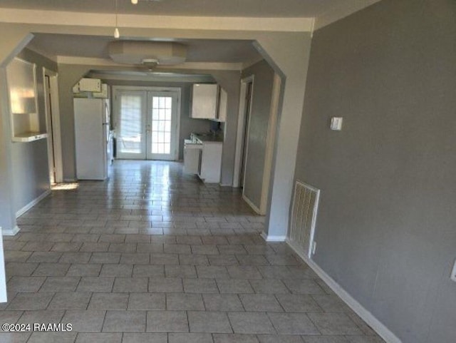 unfurnished living room with french doors