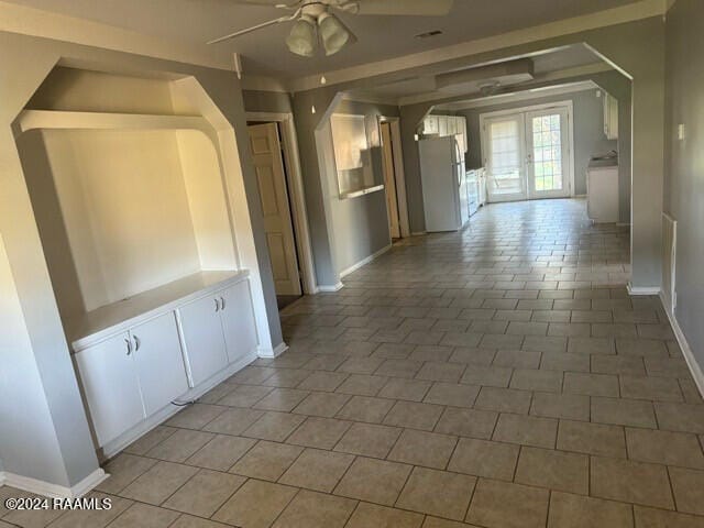 hallway featuring light tile patterned floors