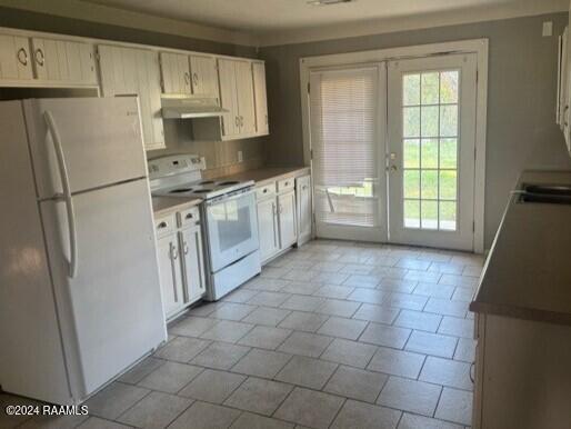 kitchen with french doors, light tile patterned floors, and white appliances