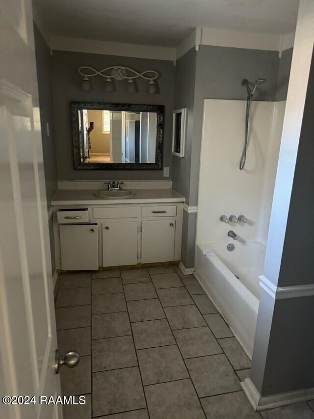 bathroom with tile patterned floors, vanity, and bathtub / shower combination