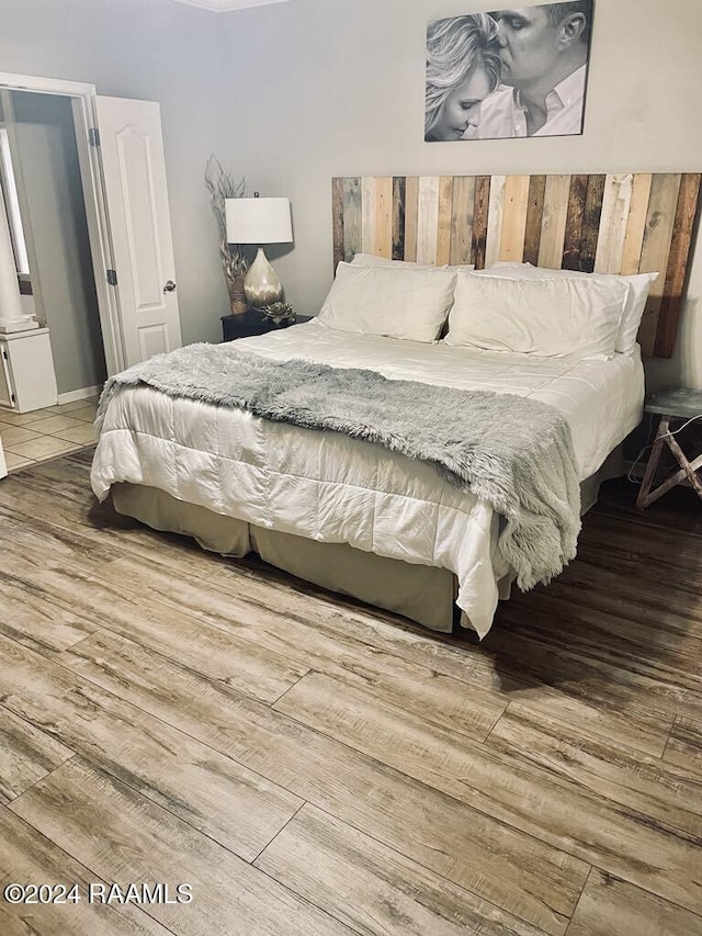 bedroom featuring hardwood / wood-style floors