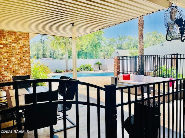 view of patio with a fenced in pool