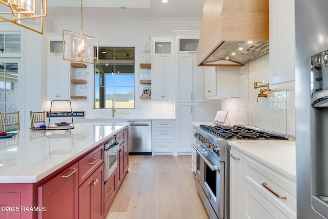 kitchen with custom exhaust hood, open shelves, light wood-type flooring, stainless steel appliances, and backsplash