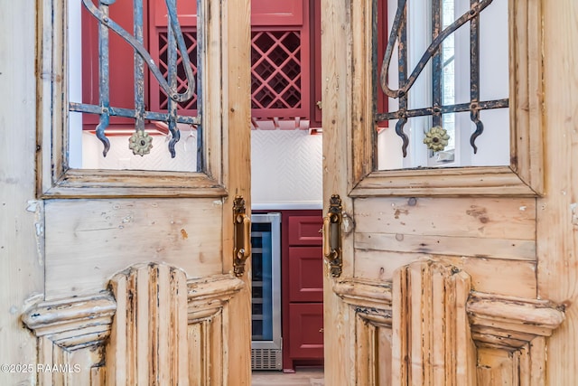 doorway to property featuring wine cooler