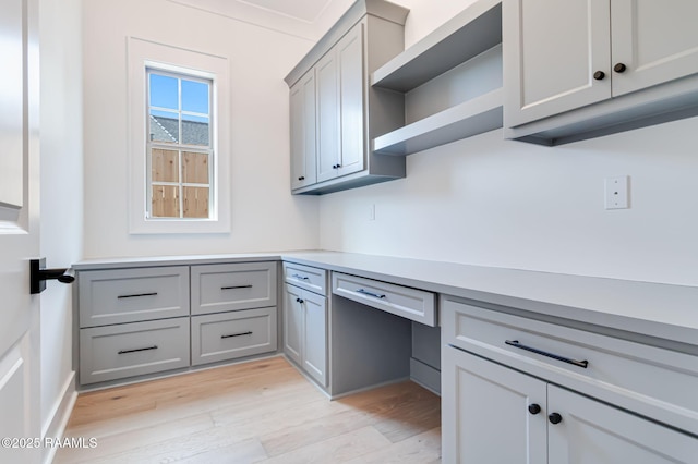 unfurnished office featuring light wood-style flooring