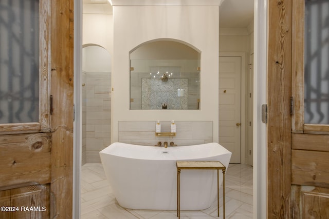 bathroom with vanity and tile walls