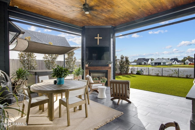 view of patio with exterior fireplace