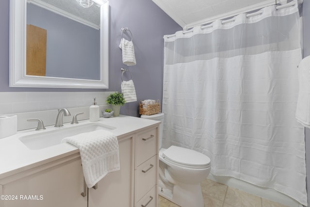 bathroom with crown molding, tile patterned flooring, vanity, and a textured ceiling