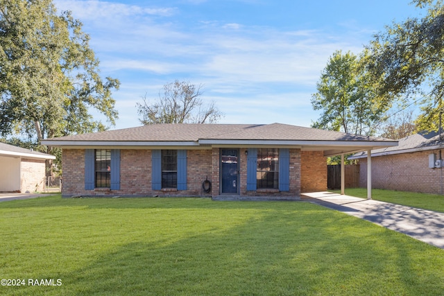 ranch-style home with a carport and a front yard