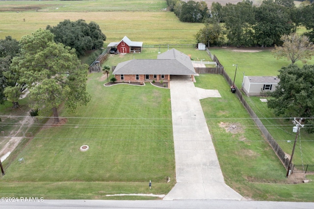 birds eye view of property featuring a rural view