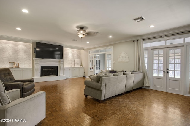 living room featuring ceiling fan, parquet flooring, ornamental molding, and french doors