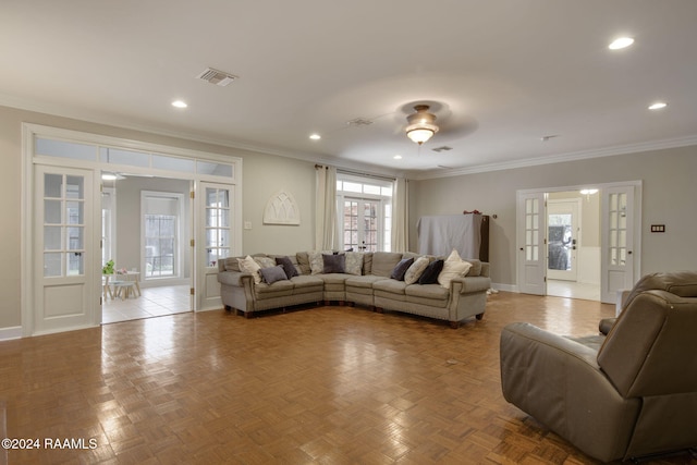 living room featuring french doors, light parquet flooring, ceiling fan, and crown molding