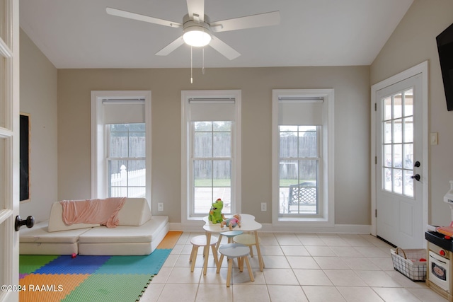 interior space with plenty of natural light, lofted ceiling, and ceiling fan