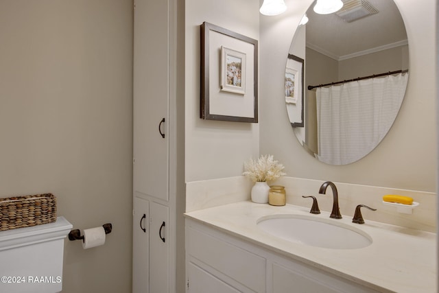 bathroom with vanity and ornamental molding