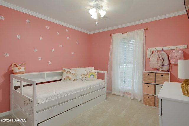 carpeted bedroom with ceiling fan and ornamental molding