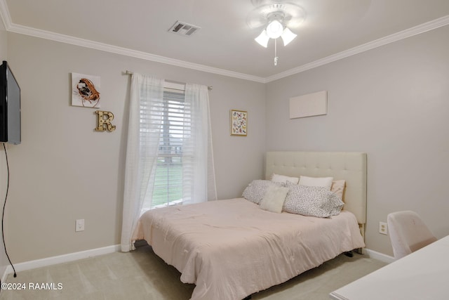 bedroom with ceiling fan, light colored carpet, and crown molding